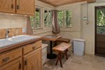 There is a double sink for easy clean up and a small dining table has Oak Creek views
